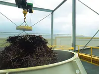 Steel scrap is fed to the leaching column