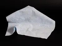 Thermo-embossed wipe